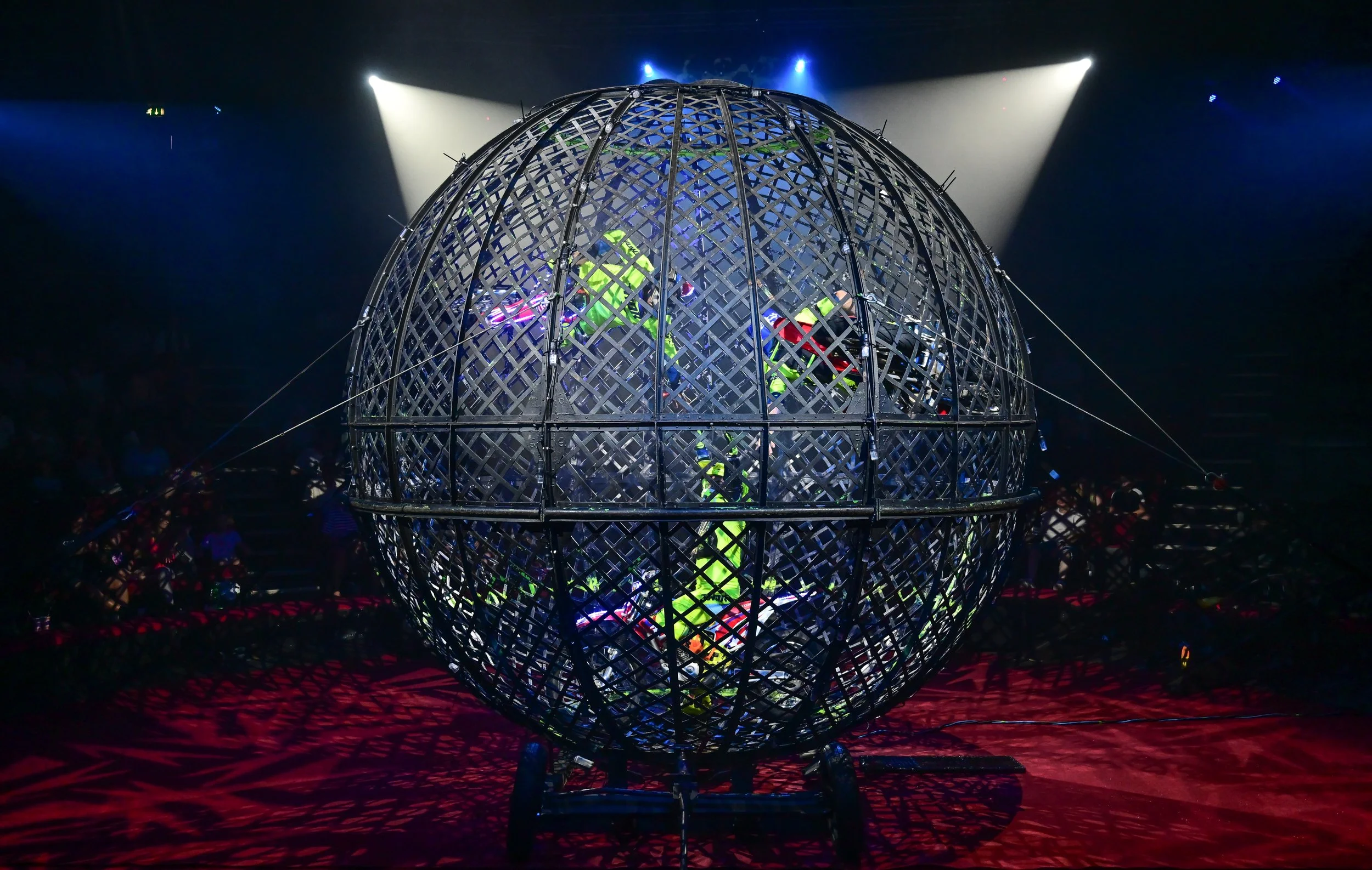 Motorbike stunt riders performing inside the globe at the Hippodrome Circus.