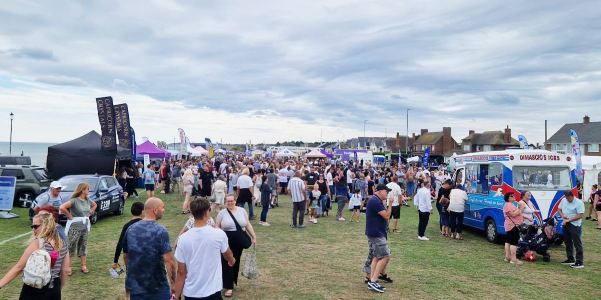 Crowds browsing stalls at Gorleston Clifftop Festival.